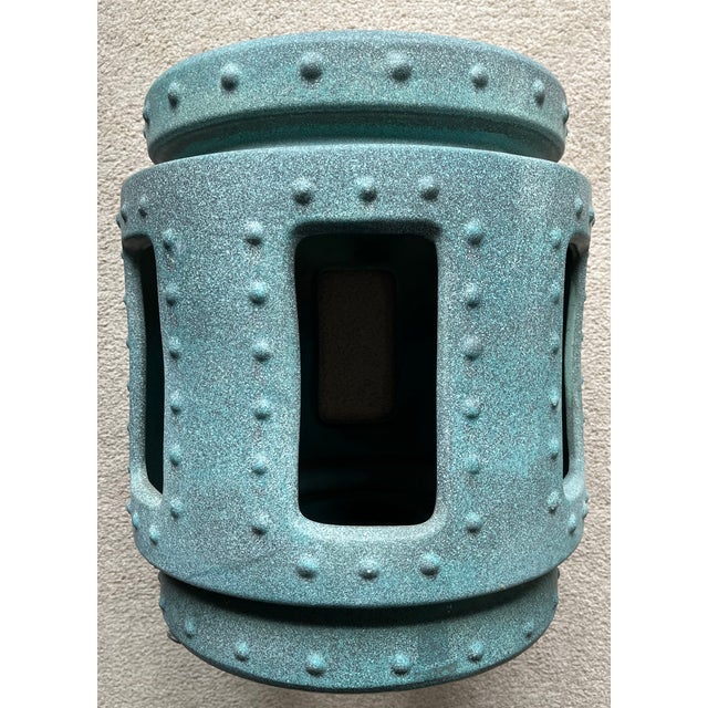 This wonderful Chinoiserie style Turquoise ceramic garden seat has a 'faux' oxidized bronze look to the finish. Nice...
