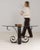 This coffee table carries genuine presence, its glass top, black wrought iron sculptural base immediately setting the tone...