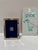 Small Tigo sterling silver picture frame with polished silver border, beaded inner edge, and blue velvet backing. Marked...