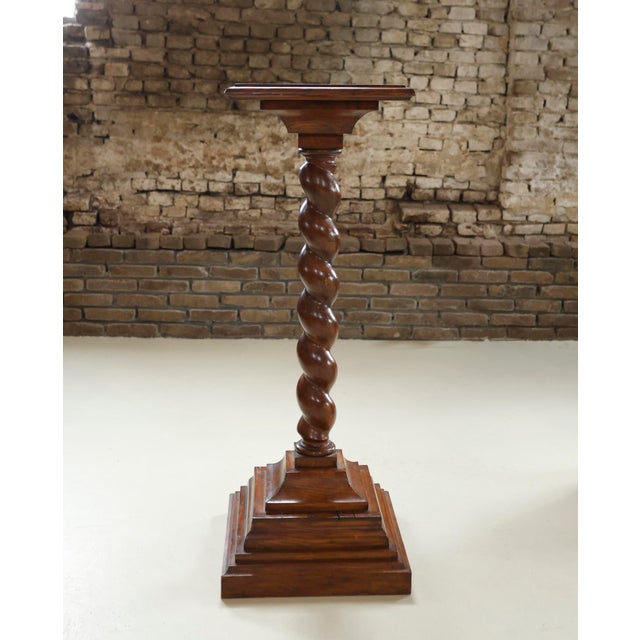 Solid oak pedestal with a finely turned barley twist (Solomonic) column on a stepped square plinth base. The top has a...