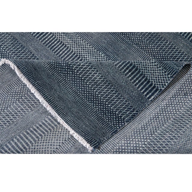 Beautiful hand-knotted wool, Savannah-Style vintage rug. This rug has a navy blue field with subtle blue toned accents in...