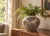 Striking vintage ceramic planter featuring an unusual all-over design of stylized fish rendered in raised relief. The...