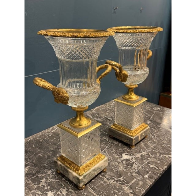 The Baccarat Manner Crystal and Gilt Bronze Vases are elegant and luxurious home décor pieces that add a touch of...