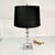 The 1970s and 80s showcased the beauty of Lucite in home furniture and decor. This is a stacking Square Cubed Table Lamp...