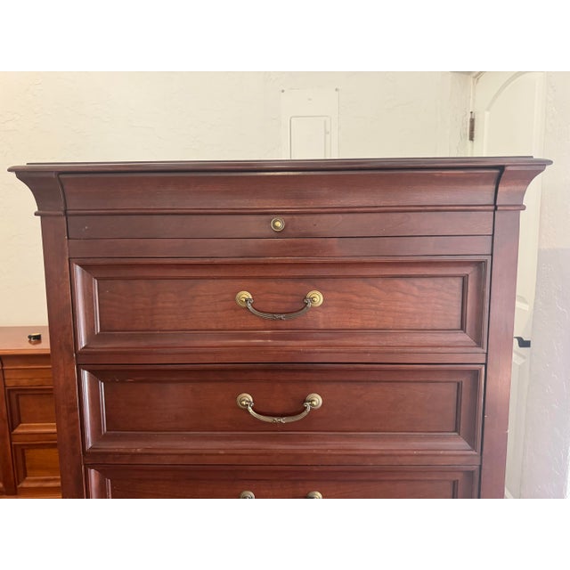 A solid cherry tall chest from Ethan Allen’s Medallion Collection, made in the United States. The design draws from French...