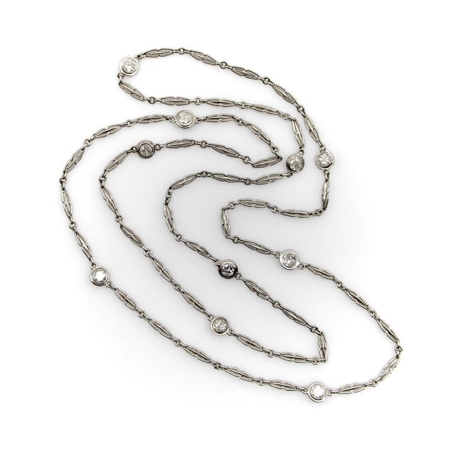 This beautiful Art Deco platinum fancy link chain contains 10 bezel set diamonds by the yard. The elongated links are...