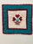 This handmade piece is a Flower Basket Tulip Quilt block crafted from various styles of calico cotton fabric. It features...