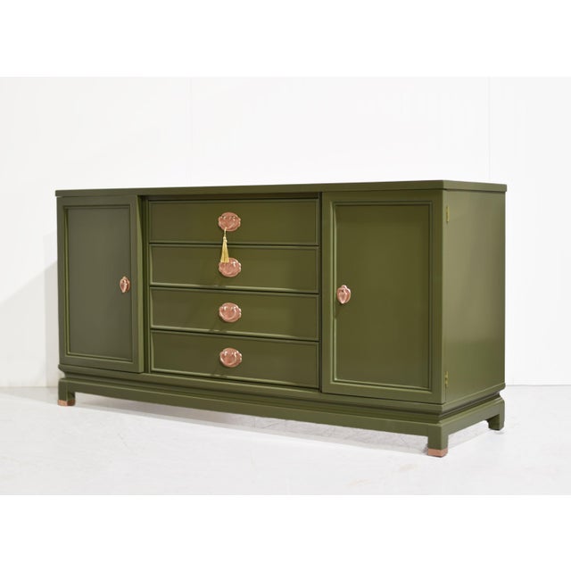 This 1960s Ming-style buffet sideboard by American of Martinsville has been freshly painted in a rich, earthy olive green...