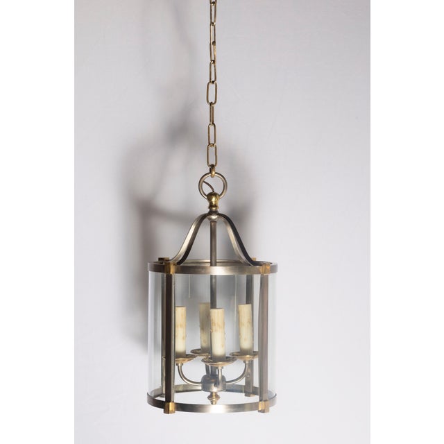 This striking early 20th-century French lantern combines timeless elegance with a sleek, modern touch. Crafted with a...