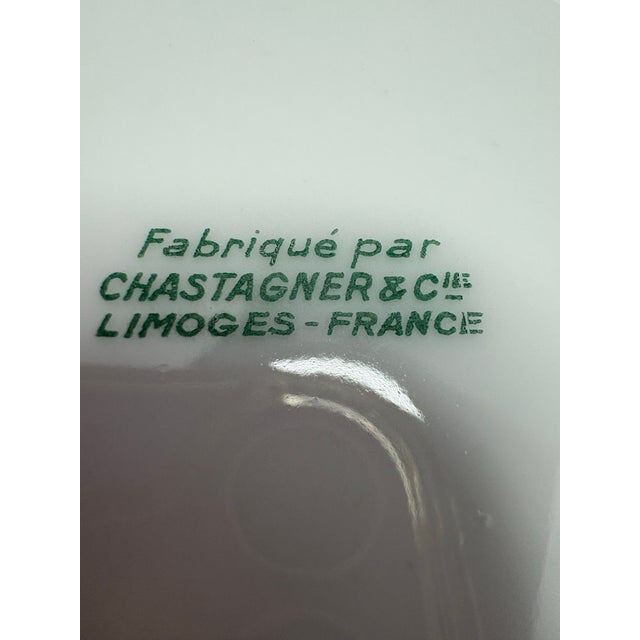 A refined French Limoges oval serving bowl crafted by Chastagner & Cie in Limoges, France. Finished in a delicate celadon...