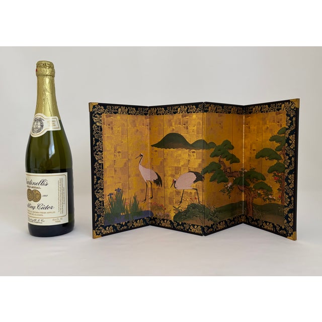 Vintage miniature six-panel tabletop screen depicting two red-crowned cranes among pine trees, irises, rocks, and distant...