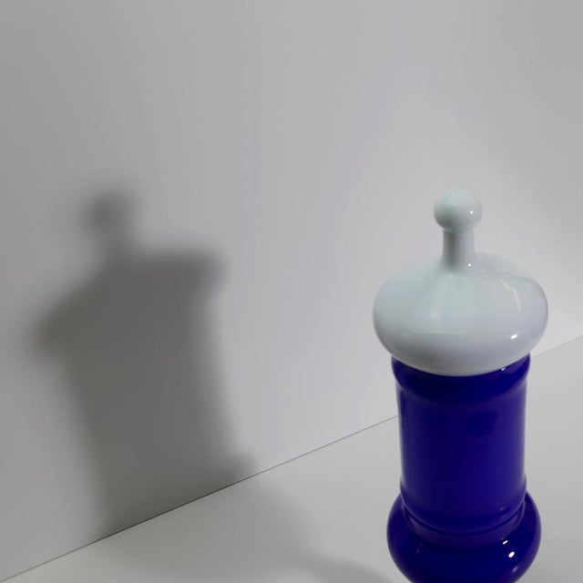 A Carlo Moretti Murano apothecary jar in striking cobalt blue and white cased glass, designed and handcrafted in Italy...
