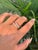 This modern diamond open-bypass ring is crafted in 14K yellow gold and features a sleek, minimalist silhouette accented...