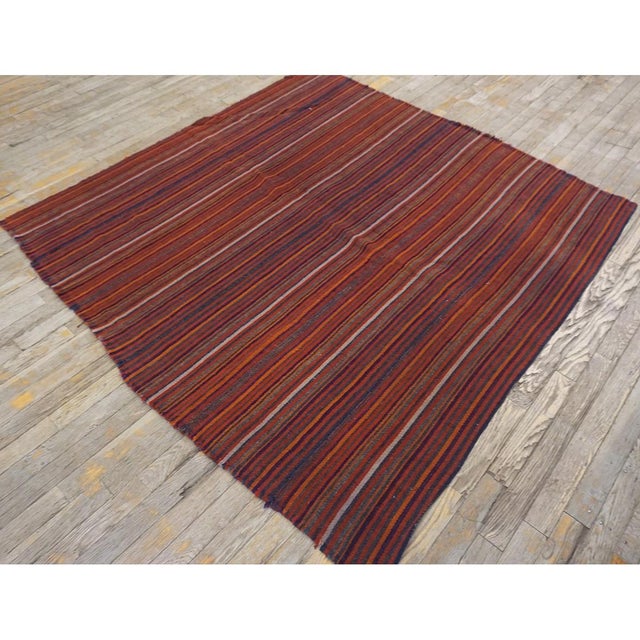 "This is a vibrant and highly authentic vintage mid-century Turkish Kilim, dating back to circa 1950. Measuring a...