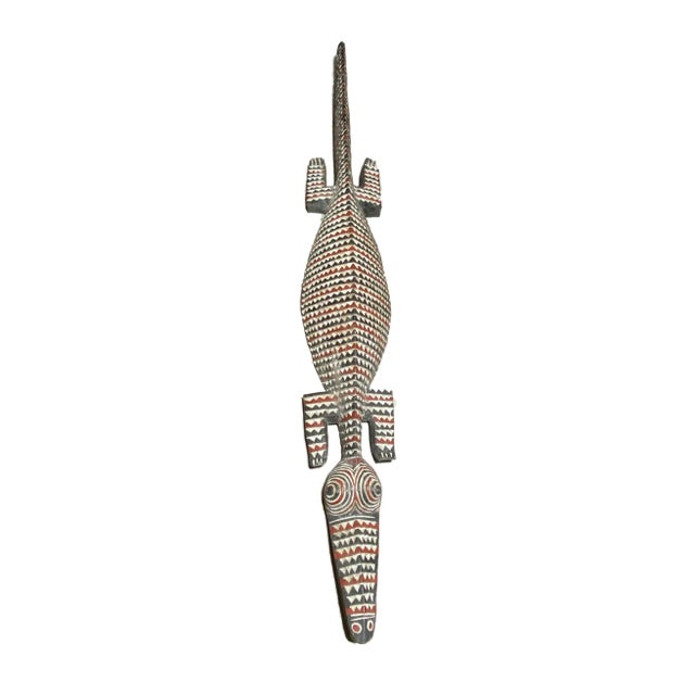 This remarkable vintage life-size Bobo Nuna Crocodile from the tribal people of Burkina Faso, measuring approximately 79"...