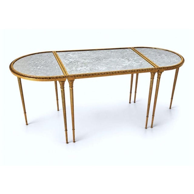 An exceptional and highly sought-after French Maison Baguès tripartite coffee table, executed in richly patinated bronze...