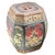 A decorative wooden Chinese rice barrel.