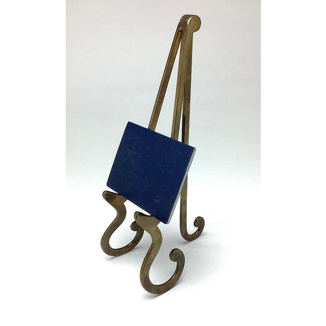 Vintage Brass Table Top Easel. This easel measures 11 1/2 inches tall by 5 inches deep by 4 inches wide standing. It does...