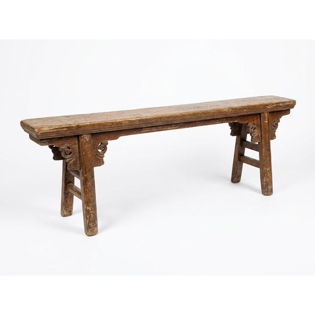 This item is an antique Chinese Provincial Qing Dynasty elm wood bench and is a beautifully handcrafted piece with a rich...