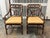 Design Plus Gallery presents a pair of Vintage McGuire Style Target Back Armchairs. These chairs showcase bamboo and...