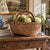 A generously scaled late-19th-century gathering basket, handwoven from narrow oak splints around a sturdy fixed wrapped...