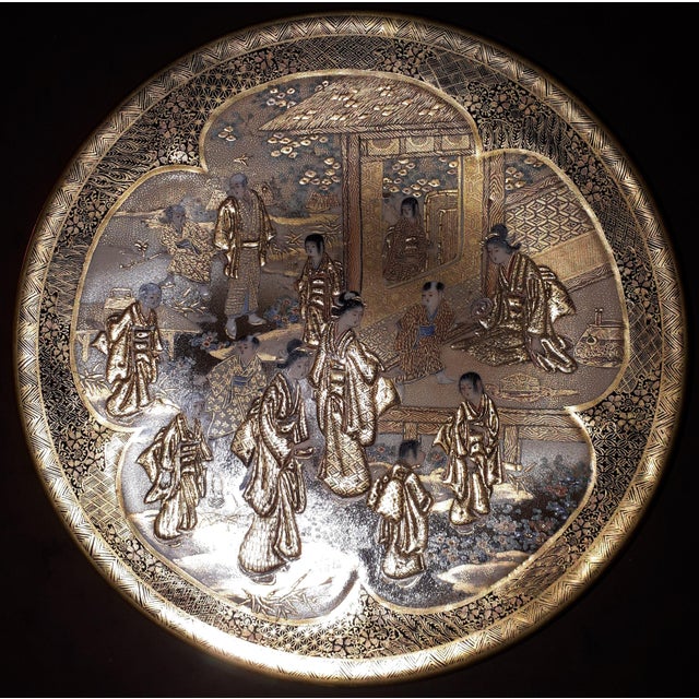 Pair of small Satsuma earthenware dishes with polychrome and gold decoration of court scenes painted in polylobed shapes...