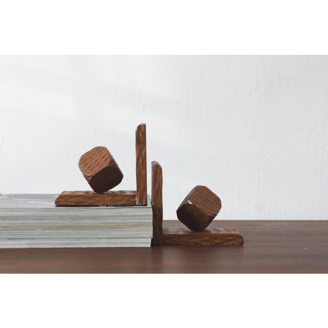 Unique, handcrafted bookends made of solid wood, designed in a modernist style with distinct influences from applied...