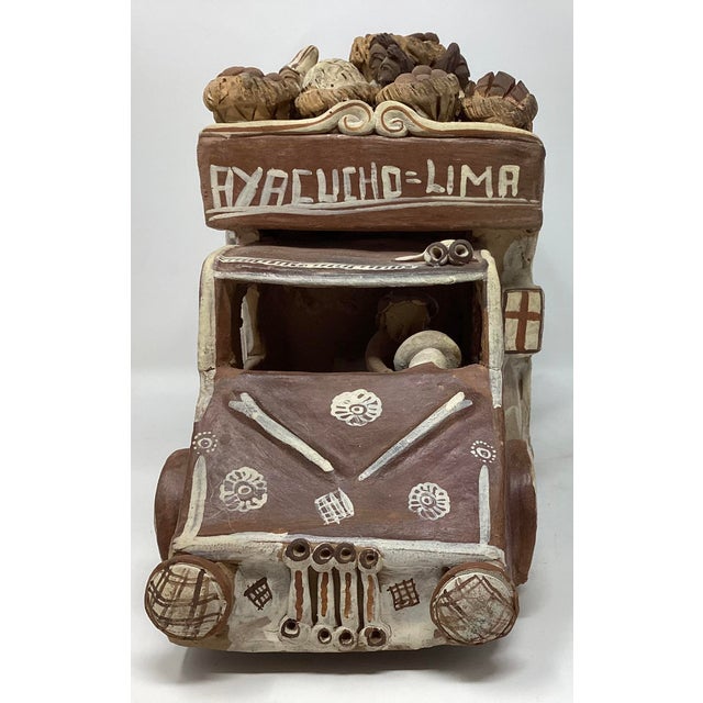 The bus is often referred to as a "chiva" open-air bus or truck. Hand sculpted and hand painted depicting a typical scene...