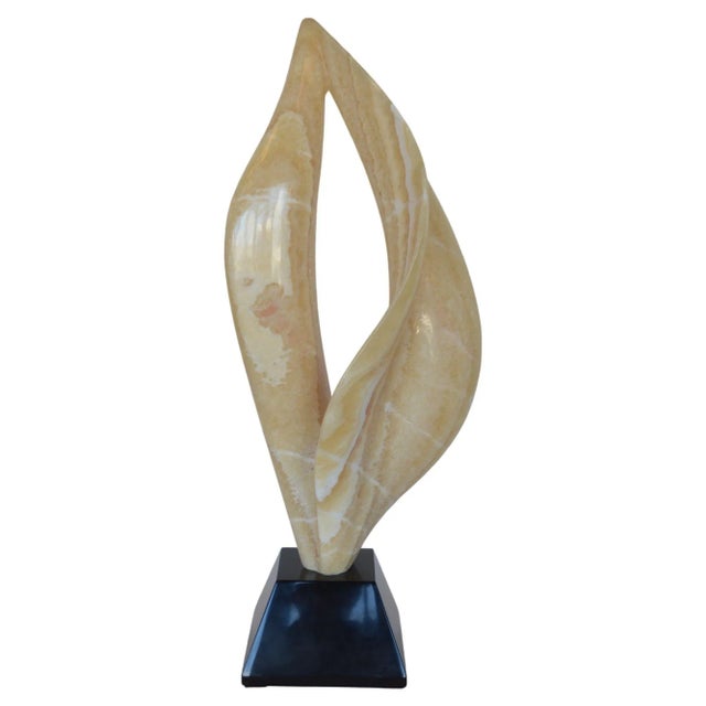 Smooth flame sculpture carved from onyx. Dimensions: 31 ½"H x 13"W x 8"D