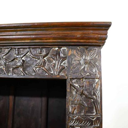 Carved Wooden Bookcase with Floral Motifs and Stylized Figures