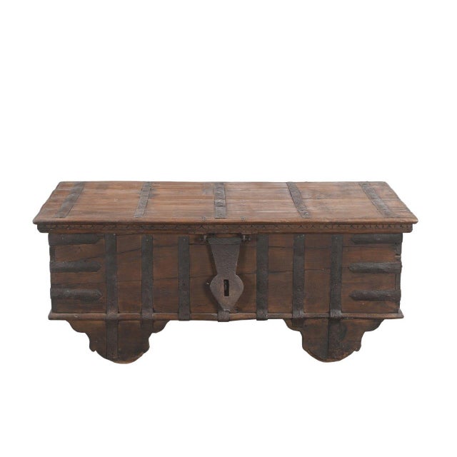 Crafted from solid teakwood, this Antique Indian Blanket Chest/Coffee Table features a beautiful natural patina, hand-...