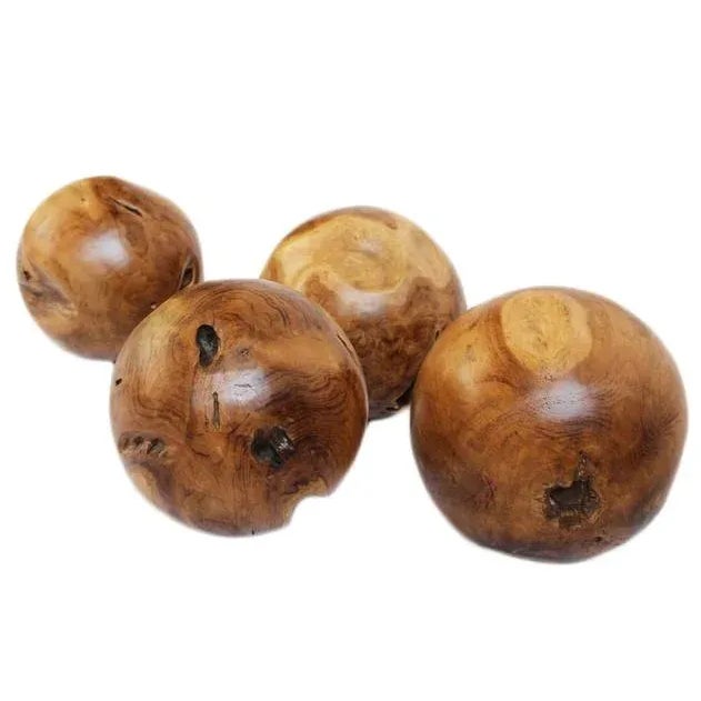 Hand-carved solid teak root sphere. Each piece showcases one-of-a-kind grain, natural knots, and organic voids that...