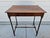 This antique Georgian style mahogany spider leg side table, features a rectangular top and slender, turned legs joined by...