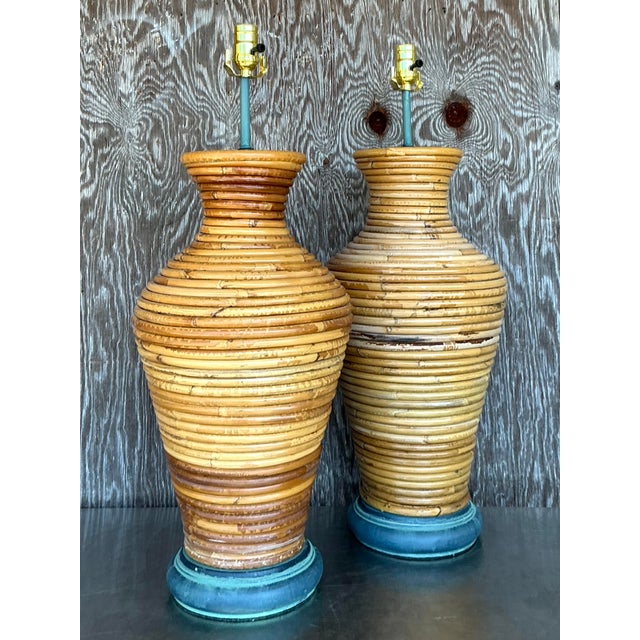 Illuminate your space with coastal charm using this stunning pair of vintage coiled pencil reed lamps. Featuring an...
