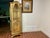 This Vintage Hollywood Regency Style Gold Lighted Curio Display Cabinet from the 1940s exudes elegance and charm. Crafted...