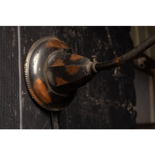 Antique wall sconce with white petticoat shade. This shade measures 8" in diameter. This lamp extends 13.5" in length from...