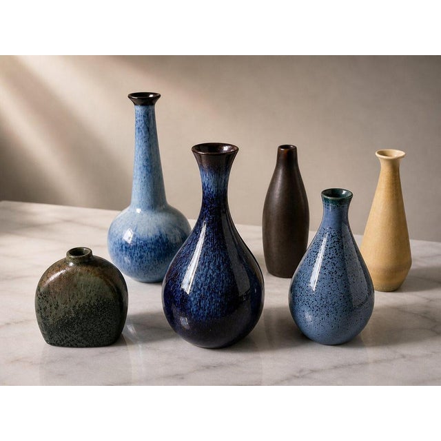 A rare and beautifully curated set of six signed Rörstrand miniature vases, executed in Sweden during the 1950s,...