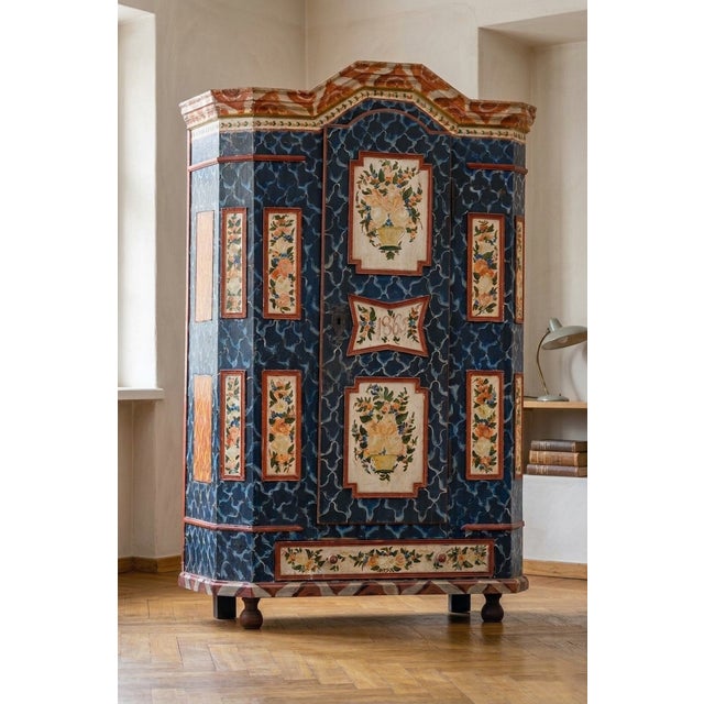 This impressive antique painted cabinet showcases the craftsmanship and decorative traditions associated with Central...