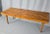 Solid Walnut and very nicely made. Classic slatted form with tapered legs, practical 4-foot size. Fine quality, excellent...