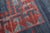 One of a kind 21st century oversize Persian rug with an open field solid design in blue and red. 100% vegetable dyed....