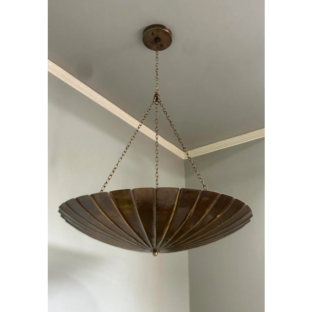 Make a bold statement in your home with this handcrafted brass chandelier pendant light, featuring a stunning scalloped...