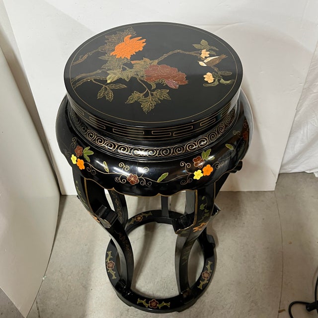 Black lacquer pedestal / plant stand with flowers and birds encased in thin brass inlay. Measurements at the widest points...