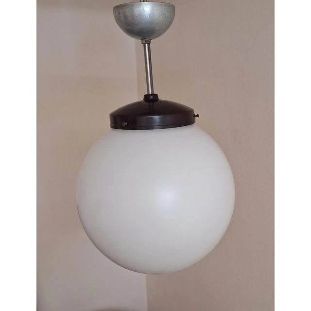 Vintage German Art Deco Ceiling Lamp by Molitor, 1930s, in Good conditions. Designed 1920 to 1949 This piece has an...