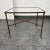 Design Plus Gallery presents a Glass + Iron Side Table. The simple table has subtle hints of craftsmanship on the hammered...