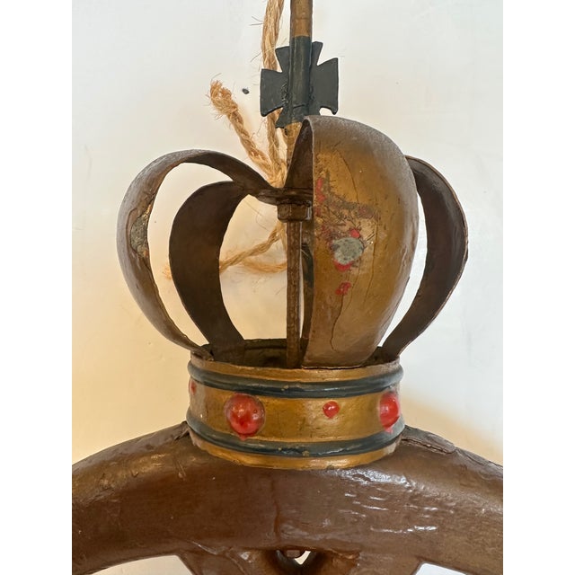 Traditional antique Scandinavian or Danish bakery sign having carved wooden pretzel topped with a metal crown. Donlon