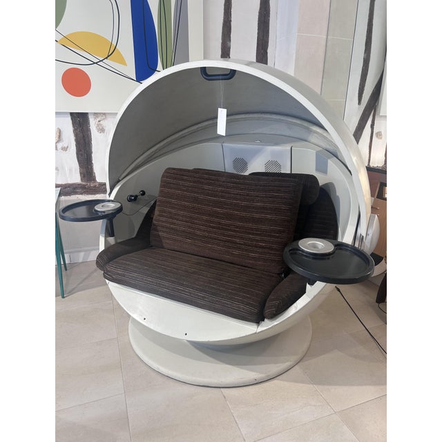 A unique indoor or outdoor chair with a completely rotating base and a folding double lounge bed and side tables. I have...