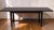 Modern Maxine Snider Black Dining Extension Table. It includes two leaves in original cloth sacks baring the metal plaque...