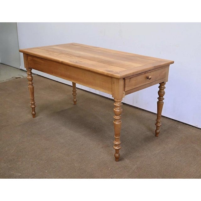 Solid blonde cherry table with one of its ends a deep drawer and a large retractable tablet, forming a service allowing...