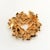 Vintage brooch embellished with a bevy of rhinestones in brown, amber, and yellow hues. Metal is gold-plated. We believe...