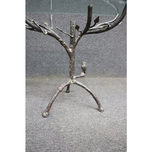 Bronze Giacometti style forged iron side table featuring a naturalistic “twig and branch” base design. The sculptural iron...